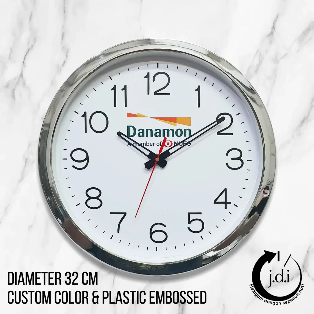 Jam dinding bank Danamon 32 cm dengan lis top chrome dan angka timbul, desain eksklusif untuk branding.